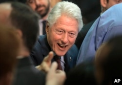 Former President Bill Clinton greets people in the audience after speaking in support of his wife, Democratic presidential candidate Hillary Clinton, at the Community College of Rhode Island in Warwick, R.I., April 14, 2016.