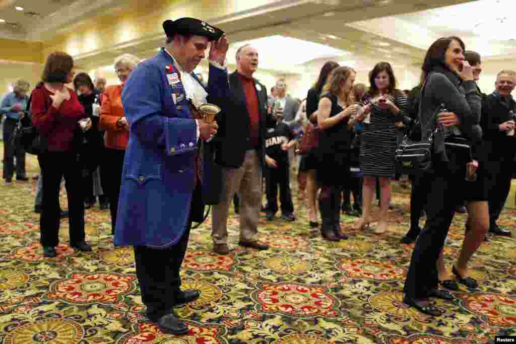 Thomas Paine re-enactor John Wallmeyer, a member of four different Tea Party organizations, waits with fellow Republican supporters for poll numbers and election results, Richmond, Virginia, Nov. 5, 2013. 