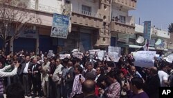 Demonstrators of Kurd origin march after Friday prayers in Qamishli, Syria, April 15, 2011