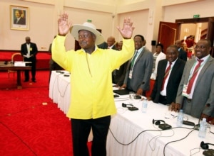 FILE - Ugandan President, Yoweri Museveni, center, gestures to delegates attending the Burundi peace talks, at Entebbe State House about 42 kilometers east of Uganda capital Kampala, Dec. 28, 2015.