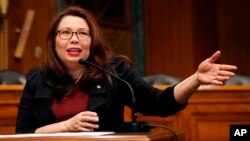 FILE - Sen. Tammy Duckworth, D-Ill., speaks on Capitol Hill, in Washington, Feb. 14, 2018.