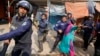 A Bangladeshi garment worker clashes with policemen during a protest in Savar, on the outskirts of Dhaka, Bangladesh, Jan. 9, 2019. 