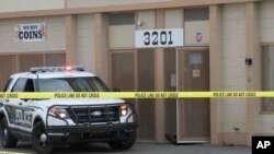 Police respond to a shooting at a precious metals shop in Anchorage, Alaska, Sept. 12, 2017.