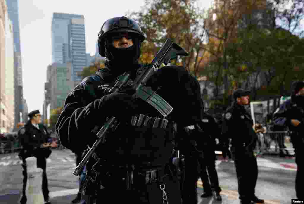 A police officer stands guard during the 95th Macy&#39;s Thanksgiving Day Parade in Manhattan, New York City.