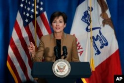 FILE - Iowa Gov. Kim Reynolds speaks during a rally for U.S. Rep. David Young, R-Iowa, in Des Moines, Iowa, Oct. 19, 2018.