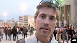 FILE - American journalist James Foley is shown in Benghazi, Libya, in this image from a video released by GlobalPost April 7, 2011.