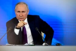 Vladimir Putin attends his annual news conference in Moscow, Dec. 23, 2021. The Russian President has urged the West to "immediately" meet Russia's demand for security guarantees.