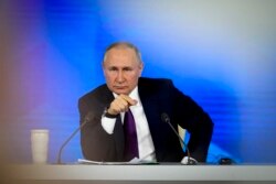 Vladimir Putin attends his annual news conference in Moscow, Dec. 23, 2021. The Russian President has urged the West to "immediately" meet Russia's demand for security guarantees.