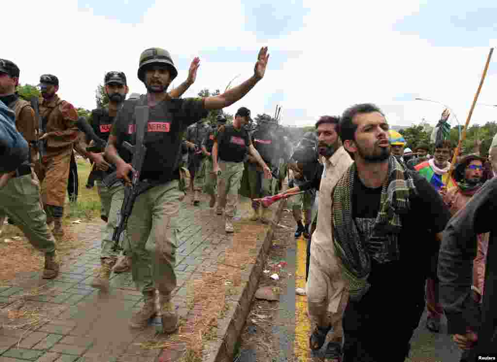 Soldiers from the Pakistan Rangers stop protesters in Islamabad, Sept. 1, 2014.