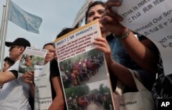 Burmese residents living in Japan, who support Myanmar's leader Aung San Suu Kyi, stage a rally against ethnic Rohingya, in front of United Nations University in Tokyo, Sept. 13, 2017.