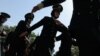 FILE - Newly-graduated female Afghan National Army (ANA) officers march during a graduation ceremony at the Afghan National Army training center in Kabul, Aug. 24, 2014. 