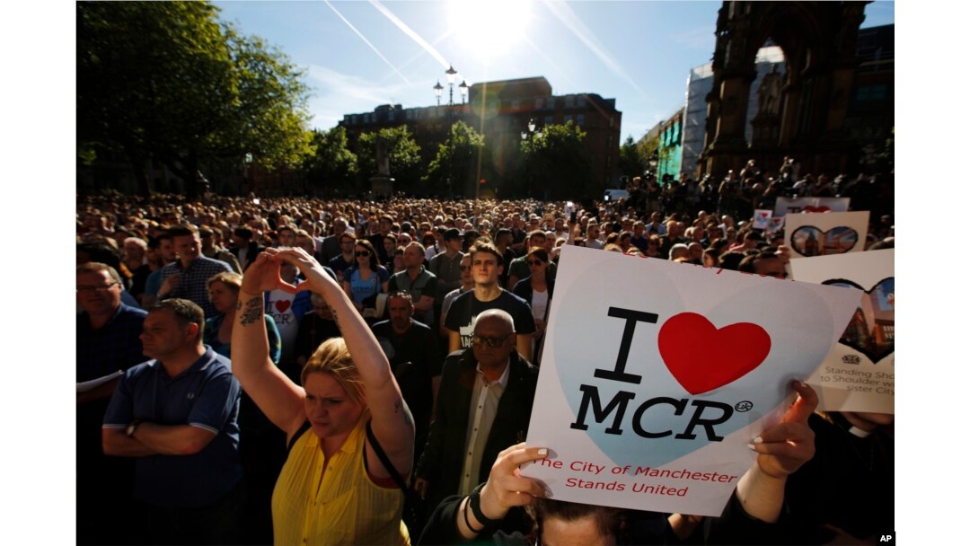 Crowds gather for a vigil in Albert Square, Manchester, England, May 23, 2017, the day after the suicide attack at an Ariana Grande concert that left 22 people dead as it ended on Monday night.