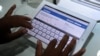 FILE-A Cambodian man inspects the ipad 2 during an Apple store opening in Phnom Penh on September 9, 2011.