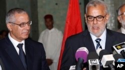 Morocco's Prime Minister Abdelilah Benkirane (R) and his Libyan counterpart Ali Zeidan speak to the media during a press conference in Rabat, Morocco, Oct. 8, 2013.