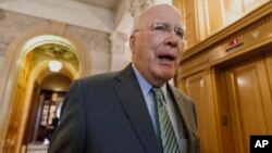 FILE - Senate Judiciary Committee Chairman Sen. Patrick Leahy, D-Vt. leaves the Senate chamber on Capitol Hill in Washington, March 2014.