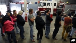 Voters line up at the Engine 26 Ladder 9 firehouse to vote on Election Day in New Orleans, Louisiana, November 6, 2012.
