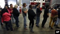 Voters line up at the Engine 26 Ladder 9 firehouse to vote on Election Day in New Orleans, Louisiana, November 6, 2012.