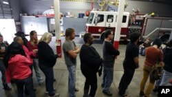 Voters line up at the Engine 26 Ladder 9 firehouse to vote on Election Day in New Orleans, Louisiana, November 6, 2012.