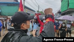 FILE - This handout photo taken and released by Dawei Watch on July 6, 2021, shows protesters taking part in a demonstration against the military coup in Dawei, Myanmar.