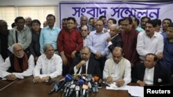 Members of Jatiya Oikyafront, an opposition alliance, hold a news conference at the National Press Club to confirm their participation in the upcoming parliamentary election in Dhaka, Bangladesh, Nov. 11, 2018. 