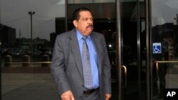 FILE - In this Aug. 22, 2013 file photo, former El Salvadoran military Col. Inocente Orlando Montano departs federal court, in Boston.