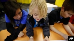 Youth from Boys & Girls Clubs of Utah County are excited to use Samsung technology in the renovated “Tween Tech Center” for the first time on Thursday, Dec. 11, 2014. (Jim Urquhart/AP Images for Boys & Girls Clubs of America)