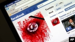 A student-run Facebook page shows an image depicting the Tunisian national flag smeared in red on a computer screen, 11 Jan 2011