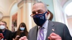 Senate Majority Leader Chuck Schumer, D-N.Y., emerges from a lengthy Democratic Caucus meeting as the Senate continues to grapple with end-of-year tasks at the Capitol in Washington, Dec. 16, 2021.