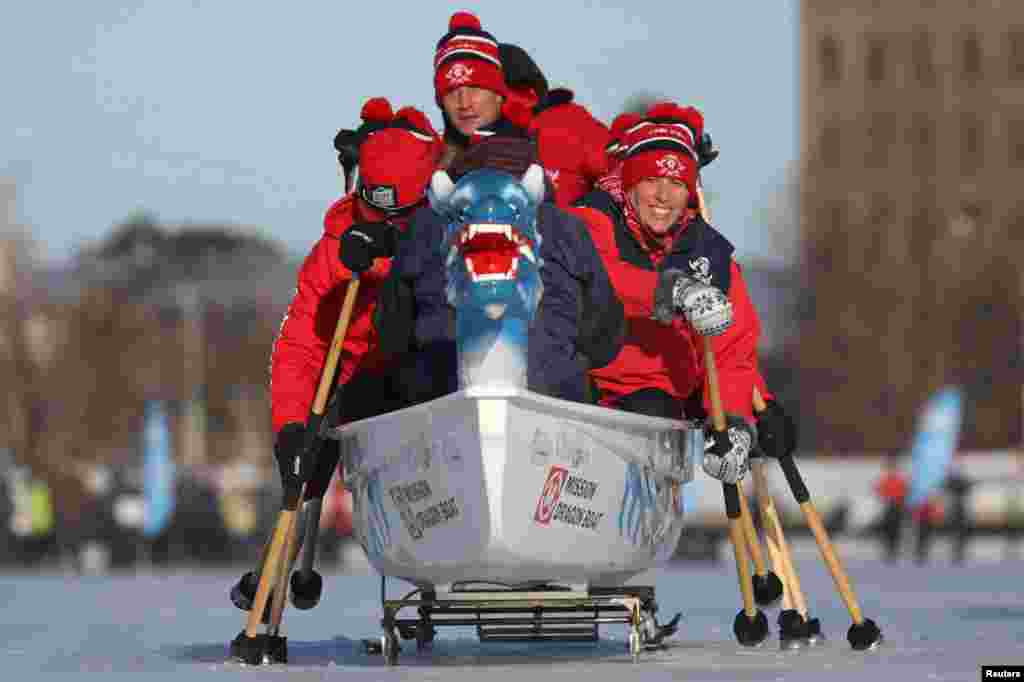 Participants compete during the Ice Dragon Boat Festival on Dows Lake in Ottawa, Ontario, Canada, Feb. 9, 2019.