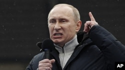 Russian Prime Minister Vladimir Putin speaks during a massive rally in his support at Luzhniki stadium in Moscow, February. 23, 2012.