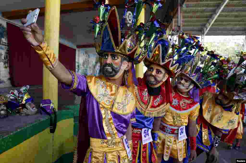 Catholics confessing their sins, known locally as &quot;Morions&quot;, take a selfie during the start of Holy Week celebrations in Mogpog, Marinduque in central Philippines.