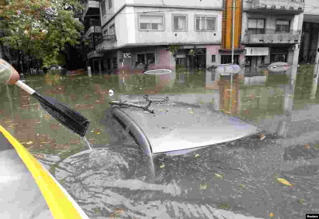 Submerged cars are seen in a flooded street after a rainstorm in Buenos Aires, Argentina.