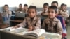 FILE - Boys study in a classroom at a school in Kerman, Iran, Oct. 23, 2016.