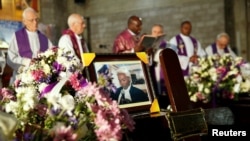 The casket with the remains of human rights lawyer Willie Kimani, who was abducted and killed alongside taxi driver Joseph Muiruri and client Josephat Mwendwa, is seen during their requiem mass at the Consolata Shrine in Westlands Nairobi, Kenya, July 8, 2016.