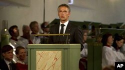 Norway's Prime Minister Jens Stoltenberg addresses mourners during the memorial service at Oslo Cathedral, Sunday, July 24, 2011