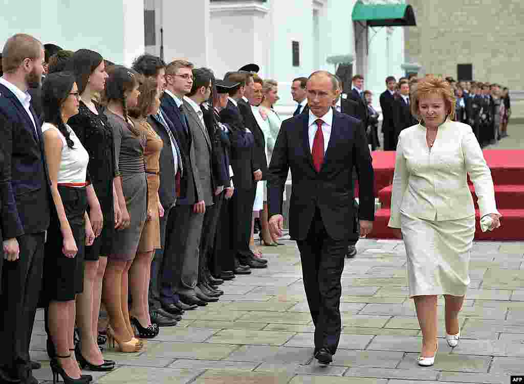 Russian President Vladimir Putin and his wife Lyudmila walk in Cathedral Square after his inauguration. (AP)