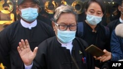 Khin Maung Zaw (C), a lawyer representing detained Myanmar civilian leader Aung San Suu Kyi and ousted president Win Myint, is pictured outside Zabuthiri Township Court in Naypyidaw on February 16, 2021. (Photo by STR / AFP)