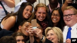 Democratic presidential candidate Hillary Clinton takes a photo with young supporters after speaking at Fort Hayes Vocational School in Columbus, Ohio, in June. (AP Photo/Jay LaPrete)