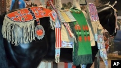 A model of how the Crow people dressed their horses in the 1880s is on display at the Museum of the American Indian. Note the beaded cradleboard for carrying an infant.