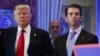 FILE - In this Jan. 11, 2017, shows President-elect Donald Trump, left, his chief financial officer Allen Weisselberg, center, and his son Donald Trump Jr., right, attend a news conference in the lobby of Trump Tower in New York. Manhattan prosecutors hav