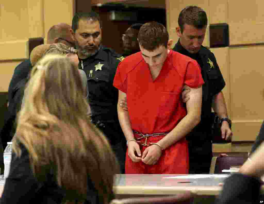 Nikolas Cruz appears in court for a status hearing before Broward Circuit Judge Elizabeth Scherer in Fort Lauderdale, Florida. Cruz is facing 17 charges of premeditated murder in the mass shooting at Marjory Stoneman Douglas High School in Parkland.