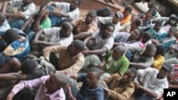 FILE: A group of 46 social and human rights activists, led by Munyaradzi Gwisai is alleged to have organized a meeting, appear in court in Harare, February 23, 2011