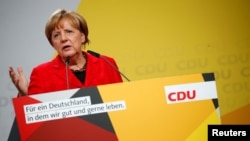 German Chancellor Angela Merkel, a top candidate of the Christian Democratic Union Party (CDU) for the upcoming general elections, speaks at an election rally in Schwerin, Germany, Sept. 19, 2017. 