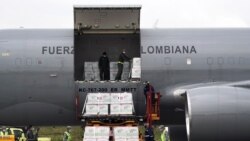 FILE - A shipment of Johnson & Johnson vaccines against the coronavirus disease, donated by the U.S., is unloaded in Bogota, Colombia, July 1, 2021. It was announced Jan. 28, 2022, that the U.S. had now shipped 400 million doses of vaccine to 112 countries.