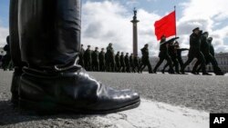 Russian soldiers march during a rehearsal for the Victory Day military parade which will take place at Dvortsovaya (Palace) Square on May 9 to celebrate 70 years after the victory in WWII, in St. Petersburg, Russia, April 30, 2015.