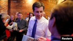 Democratic 2020 U.S. presidential candidate Pete Buttigieg greets voters during a campaign stop at Portsmouth Gas Light, in Portsmouth, New Hampshire, March 8, 2019.