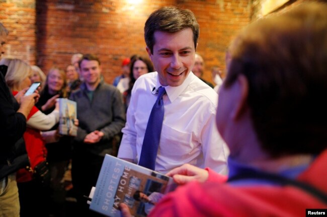 Democratic 2020 U.S. presidential candidate Pete Buttigieg greets voters during a campaign stop at Portsmouth Gas Light, in Portsmouth, New Hampshire, March 8, 2019.