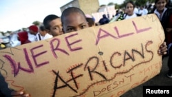 Migrants in Cape Town's Mannenberg community demonstrate against xenophobia. (UTERS/Mike Hutchings)