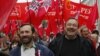 Opposition activists Gennady Gudkov, right, and Ilya Ponomarev, a lawmaker, left, march with opposition supporters heading to a protest rally in Moscow, September 15, 2012.