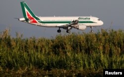 FILE - An Alitalia airplane approaches to land at Fiumicino airport in Rome, Italy, Oct. 24, 2018.